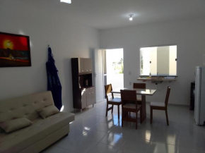 Sol Apartamento 4 - Quarto e sala com varanda e cozinha americana na praia do prea-CE